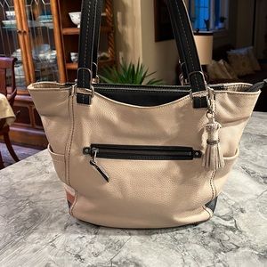 The Sak tan and black leather satchel. Top main zipper. Very good condition.